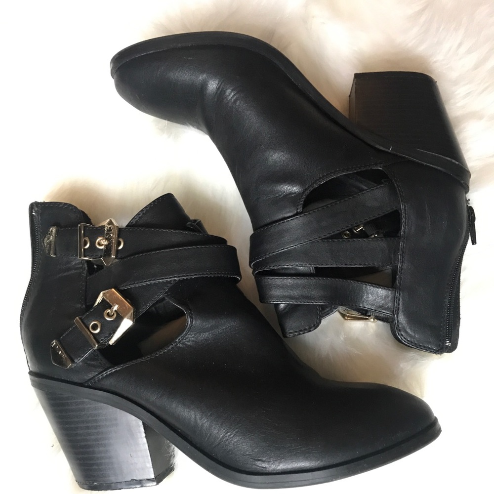 Black booties with gold buckles
